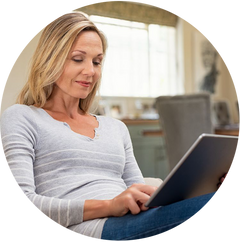 Woman on laptop sofa